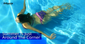 A woman swimming in the water with her head above the water.