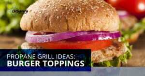 A close up of a sandwich with tomatoes and onions