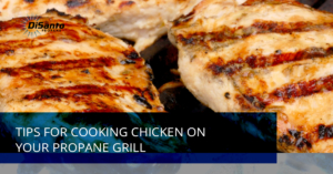 A close up of some chicken on a grill