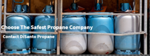 A group of propane tanks sitting in front of each other.