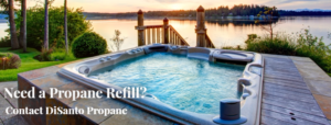 A hot tub with the water in front of it.