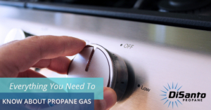A person is turning on the gas stove.