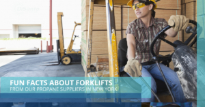 A man sitting in front of a forklift.