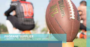 A close up of a football and a glove