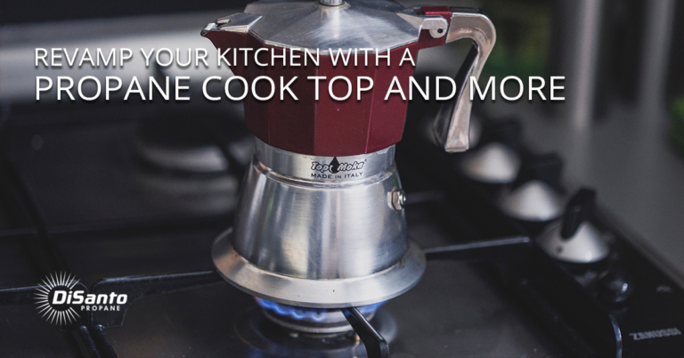A red and silver coffee pot on top of a stove.