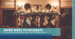 A fireplace with stockings hanging on it.