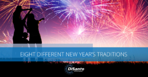 A person standing in front of fireworks with the words different new year 's traditions written on top.