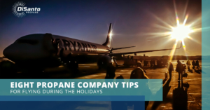 A plane is sitting on the tarmac at an airport.