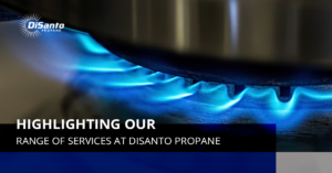 A blue flame is lit on the side of a gas stove.