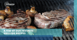 A grill with some meat on it and mushrooms