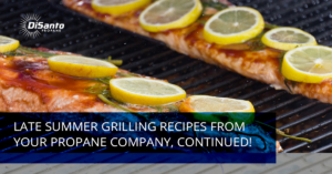 A grill with lemons and other food on it.